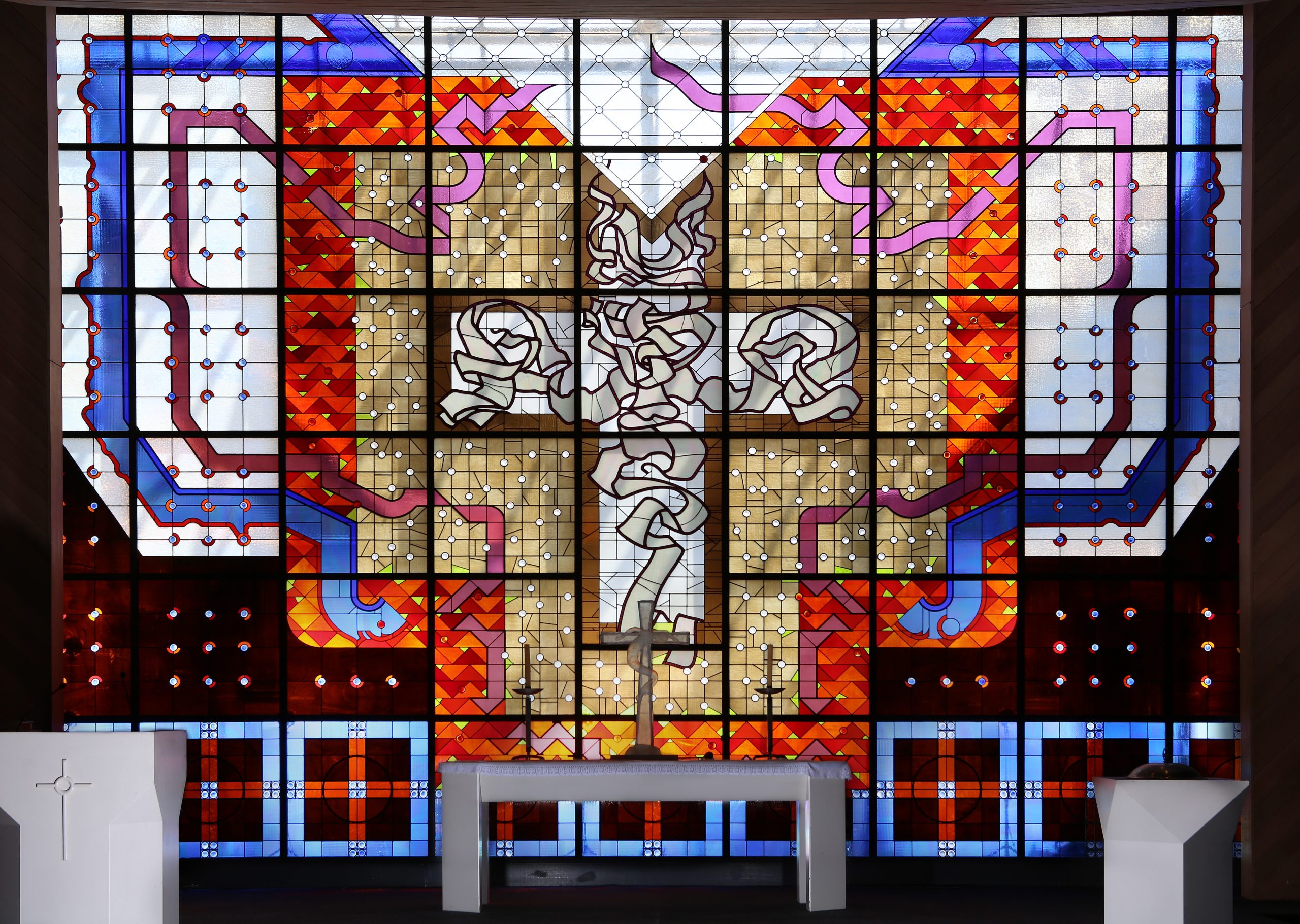 The cross is central to this stained-glass window featured in Luther College's chapel at Croydon Hills, Victoria